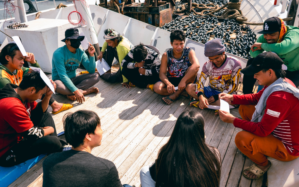 Fisherman sitting in group Fisherman sitting in group